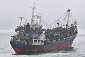 Canadians have been caught up in the drama of the arrival of a small boat with 500 people aboard. They have travelled for several months on the Pacific Ocean, turned away in Thailand, Australia, and given the cold shoulder everywhere else until they reached the western shore of Vancouver Island, escorted by the Canadian navy.